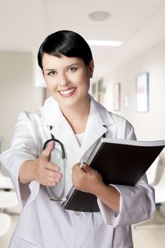 brunette female doctor on duty welcoming patient at the hospital, friendly professional, healthcare