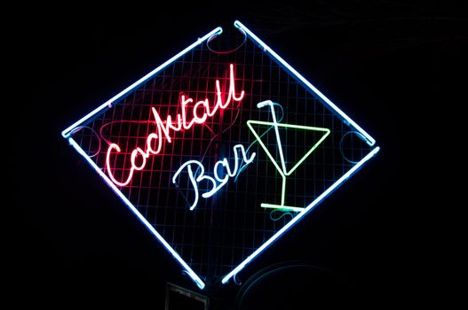 Cocktail bar neon sign illuminated at night