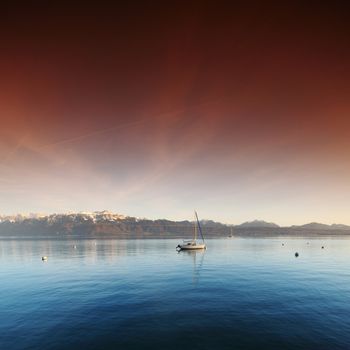 yacht in lake of geneva landscape on sunrise