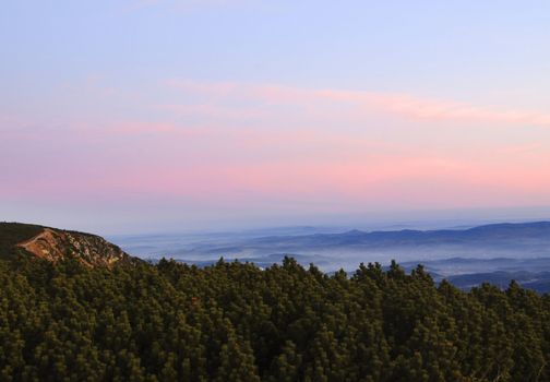 Beautiful vivid sunrise seen from the mountain peeks