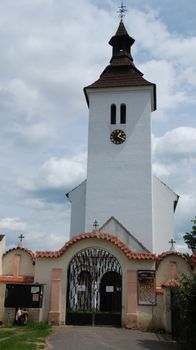 Old Czech church in the country with a graveyard