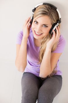 young beautiful woman listen music with headphones isolated