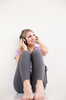 young beautiful woman listen music with headphones isolated