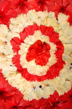 Beautiful floral oranements made of red and yellow hibiscus blooms