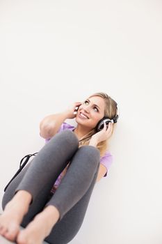 young beautiful woman listen music with headphones isolated