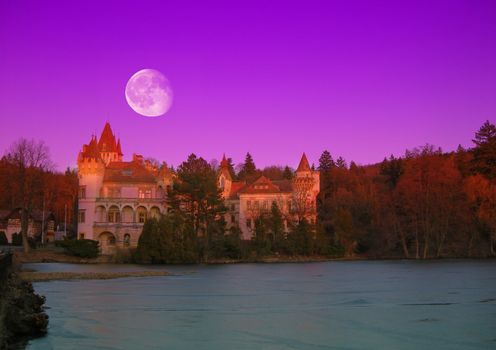              Beautiful romantic castle with river and forest in night with a moon   