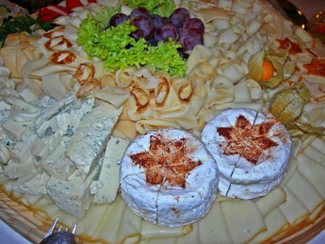 Decorative plate with cheese on the wedding celebration