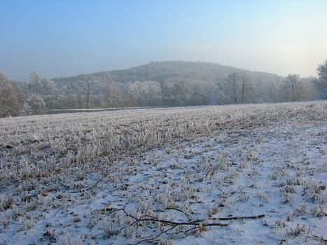      Field in the country is covered by snow and ice     