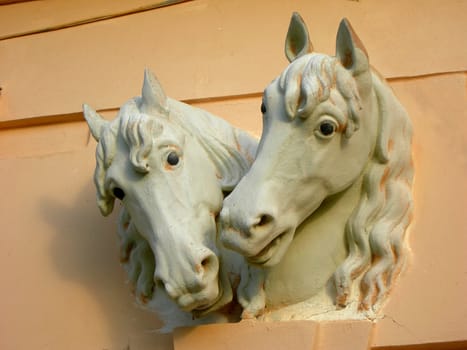           Castle decorative element - sulpture of two horse heads