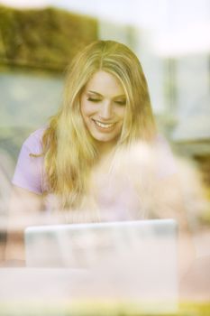 young beautiful woman using a laptop computer at home