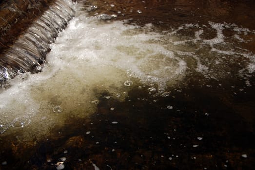 Detail of a brook with a small cascade