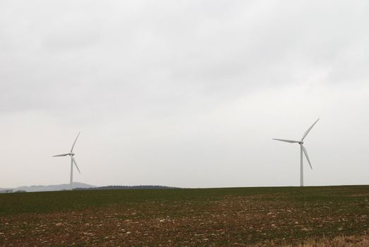 Wind turbines in movement in the fields