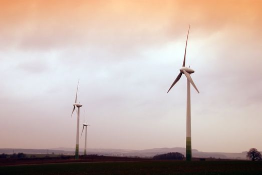 Wind turbine propeller and a sunset sky