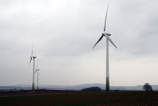 Wind turbines in movement in the fields