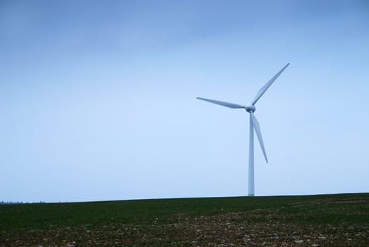 Wind turbines in movement in the fields