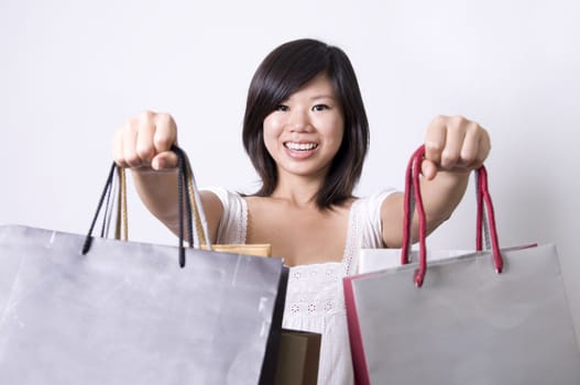 asian girl with shopping bags