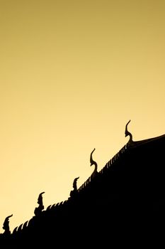 silhouette of thai temple during sunset
