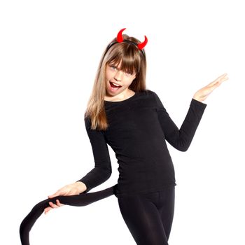 girl in devil costume waving his tail on a white background
