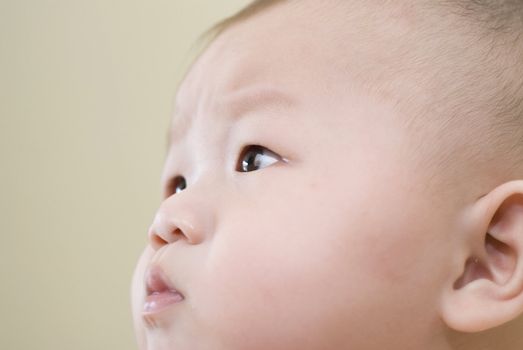 confused looking asian baby