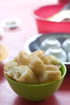  'Yau Char Kuai' (literally translated to 'Oil Fried Ghost'), a crispy fried flour Malaysian snack