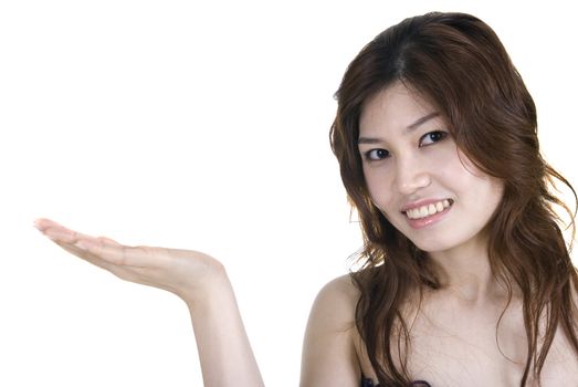 Asian girl with hand facing up for product shoot 