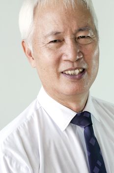 close up shot of senior asian business man smiling