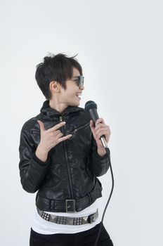 asian female rock star holding a microphone and singing