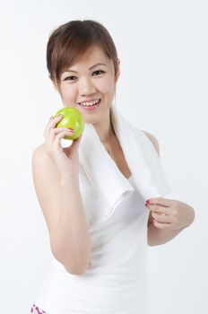 healthy young asian with an apple after exercize 
