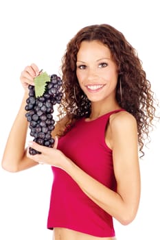 Happy brunette holding grape, isolated on white background