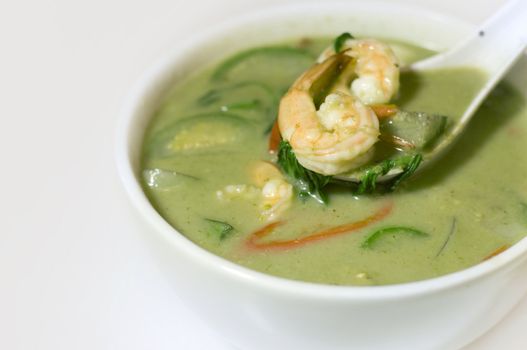 delicious thai food: green curry in a white bowl 