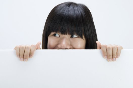 asian girl hiding with a blank card board
