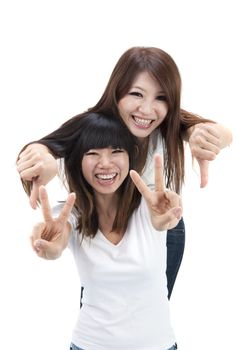 two asian girls having fun with isolated white background 