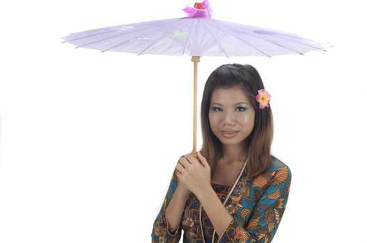malay girl with hand holding umbrella with kebaya dress