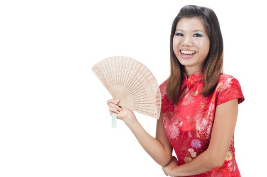 chinese new year girl  smiling and holding a fan with isolated white background 