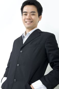 happy asian business man wearing a coat