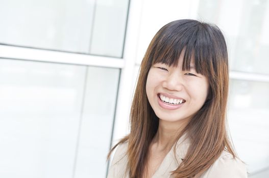 asian business women smiling with office background