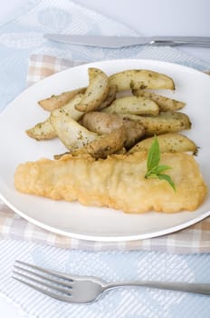 fish and chips meal on a table with table cloth