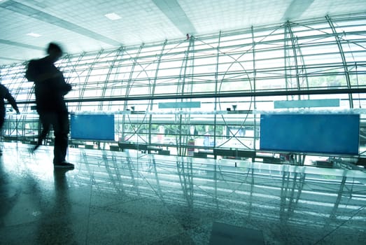 abstract of people walking at airport in blue tone