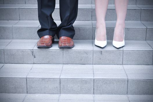 Bride and Groom standing on stairs 