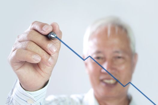 senior asian business man drawing upward trend graph 