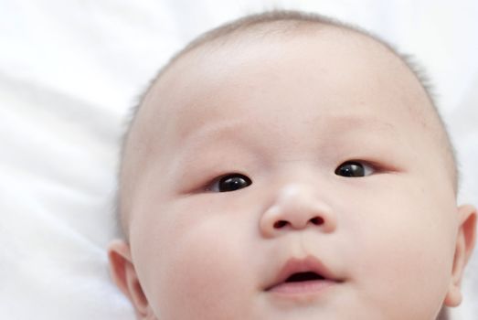 close up face photo of asian baby