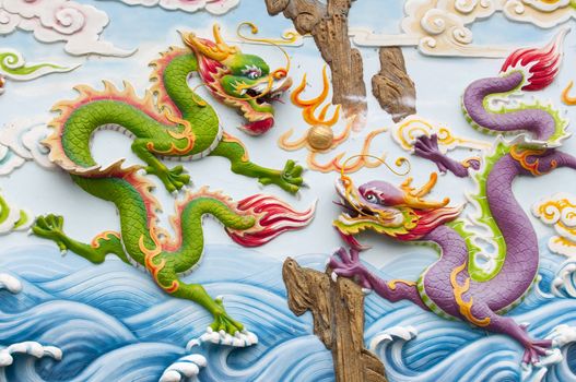 chinese dragon carving on a wall