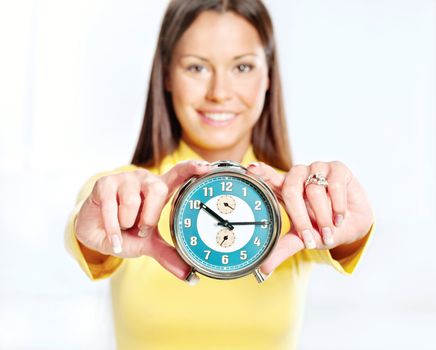 analog alarm clock and woman