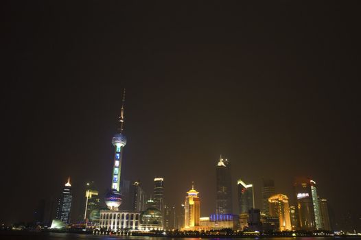 urban night view of shanghai city from pudong with a lot of empty spaces for advertising purpose