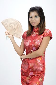 chinese girl in cheongsam and fan