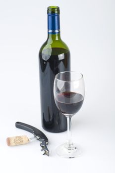 Bottle of red wine with a glass
