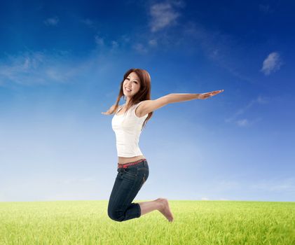 asian girl jumping with green background