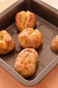 baked potatoes on an oven plate