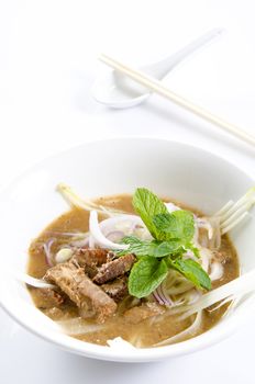 malaysian famous assam laksa isolated in white