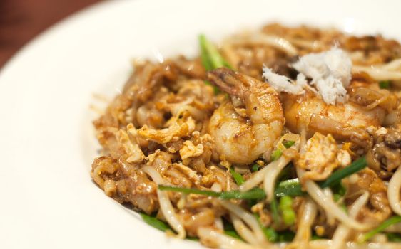 Fried Penang Char Kuey Teow which is a popular noodle dish in Malaysia, Indonesia, Brunei and Singapore
